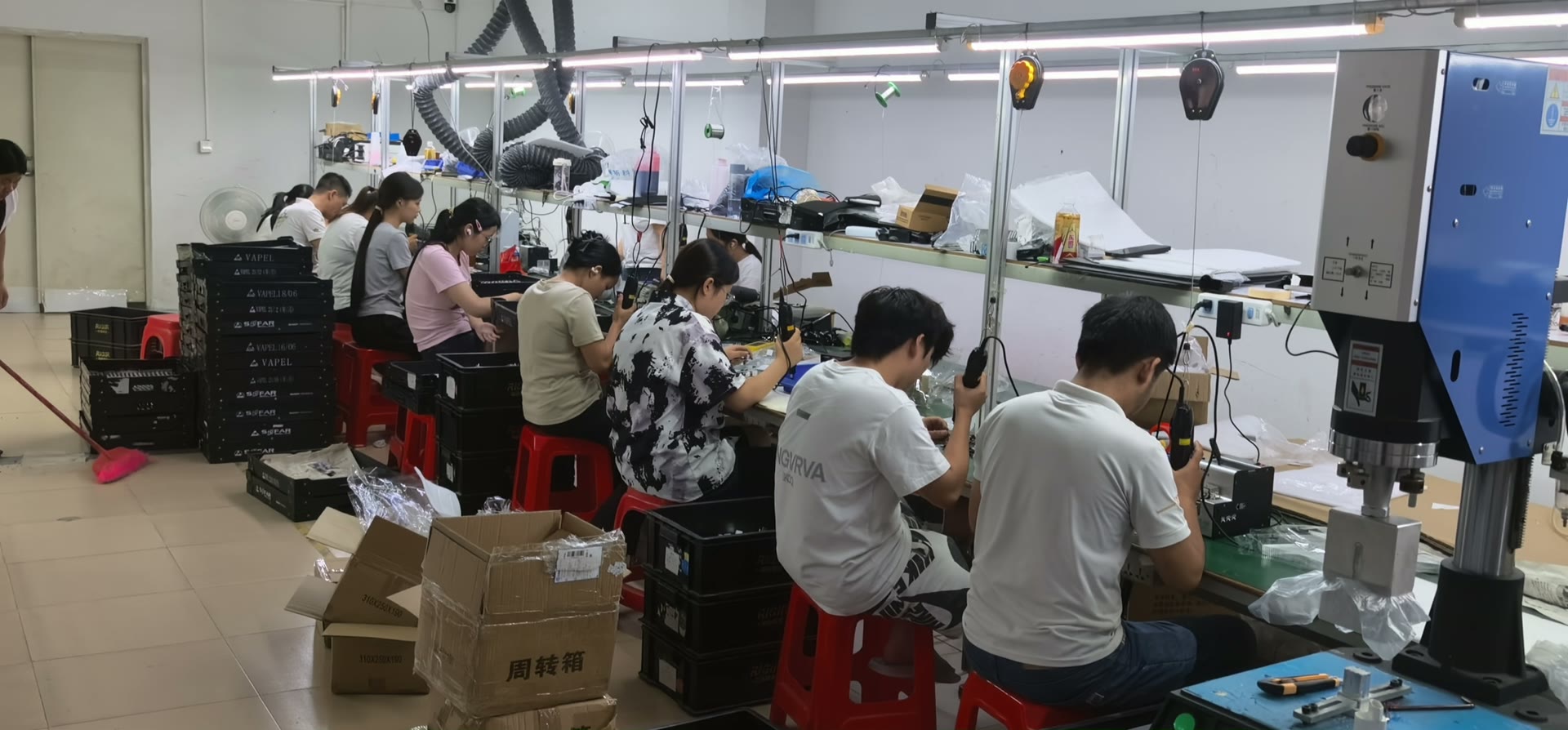 Assembly hall with production lines and operators
